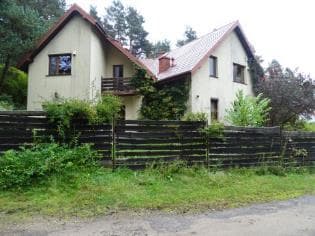 Nieruchomość zabudowana budynkiem mieszkalnym i gospodarczym