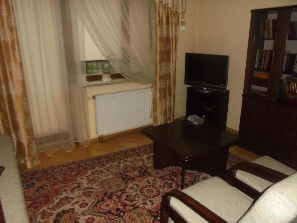 udział dłużniczki wynoszący 99/100 części w nieruchomości oznaczonej jako: działka nr 1824 o pow. 0,0600 ha zabudowana murowanym budynkiem mieszkalnym jednorodzinnym z poddaszem użytkowym oraz wysokim przyziemiem o powierzchni użytkowej 201,90m2, – zdjęcie 4 z 15