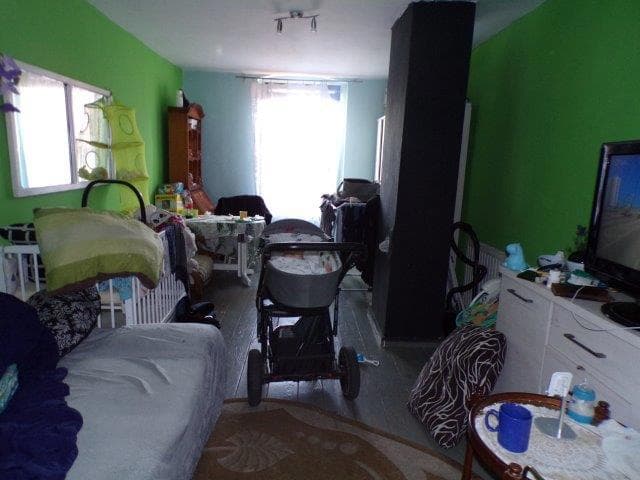 lokal mieszkalny - 3 pokoje, spiżarnia, kuchnia, przedpokój, łazienka na parterze, pokój na poddaszu o pow. 89,2300 m2, udział związany z własnościa lokalu 625 / 1000